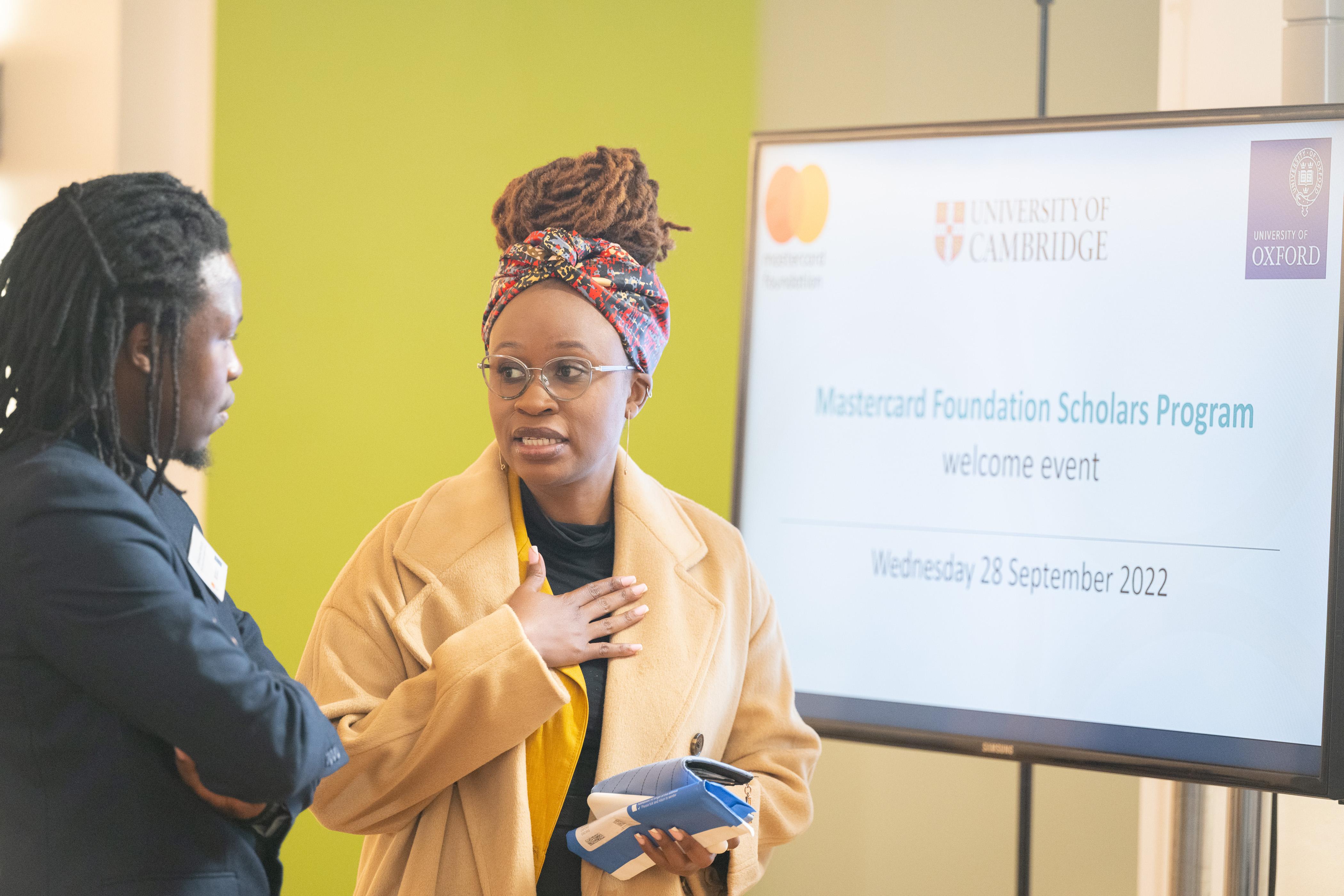 Daisy Mpando talking to Chimwemwe Manyozo at Mastercard Foundation Afox scholarship launch