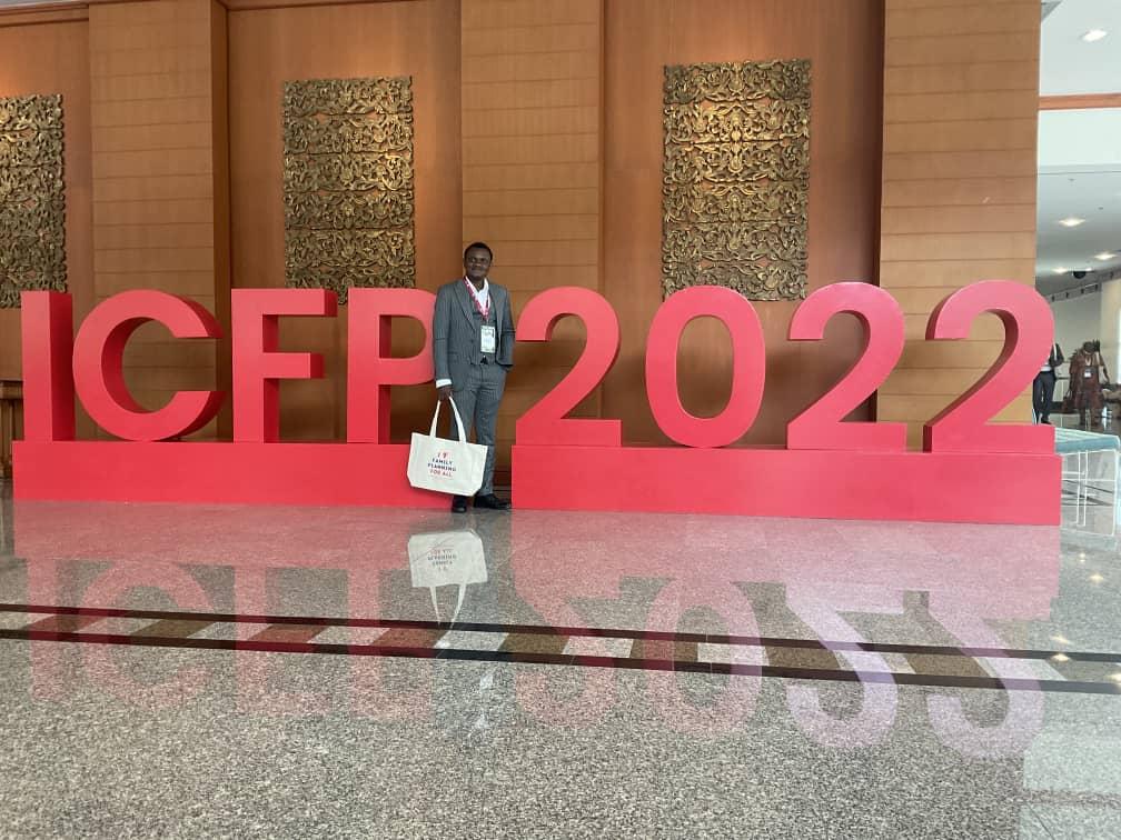 An image of a man posing with an ICFP 2022 background